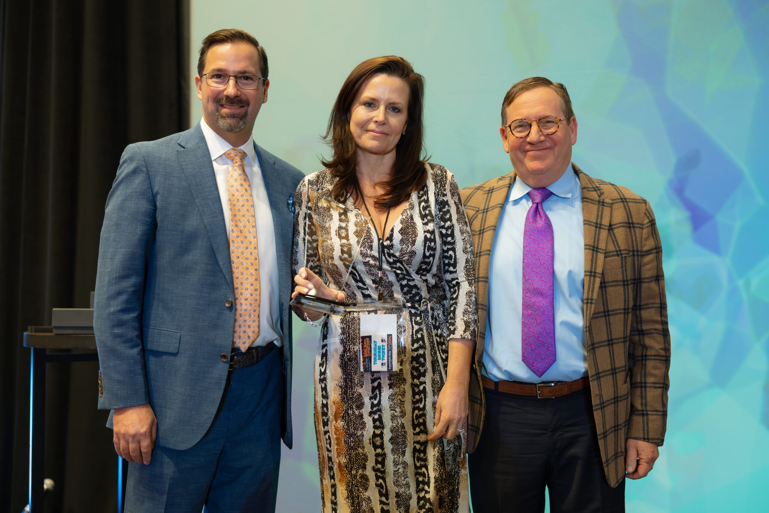 Roger Moczygemba, MD, Antrea Ferguson and Shankar Poncelet smiling Beacon Award Winners 2022